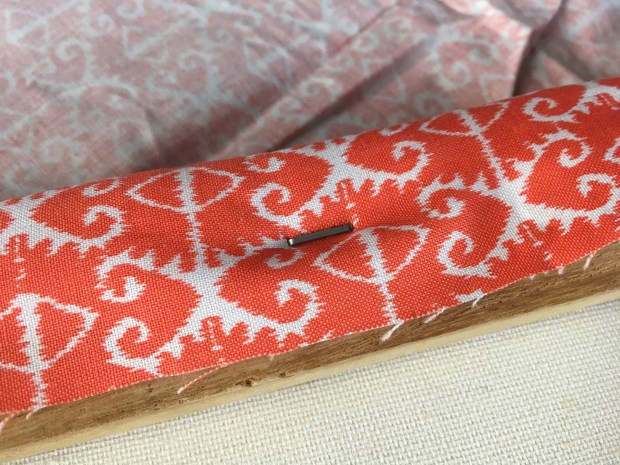 Fabric stapled onto canvas